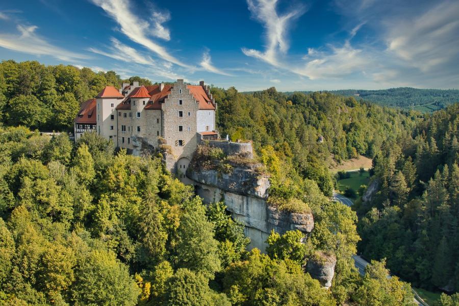 The castle was built on a rocky outcrop in the forest, which is one of the reasons it is so unique